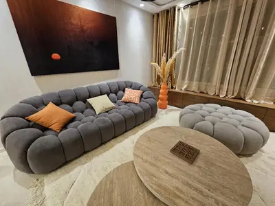 a living room with a couch and a table at Luxurious New Designer Apartment in Marrakech in Marrakech
