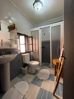 a bathroom with a toilet and a sink and a shower at Riad Darkom Private in Marrakech