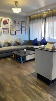 a living room with a couch and a table at Ideal stay near Medina and historical sites in Marrakech