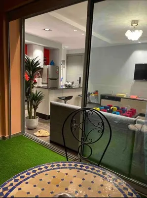 a room with a view of a kitchen and a living room at Ideal stay near Medina and historical sites in Marrakech