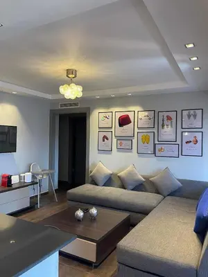 a living room with a couch and a table at Ideal stay near Medina and historical sites in Marrakech
