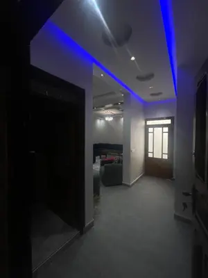 an empty room with blue lights on the ceiling at Cozy Part in Marrakech