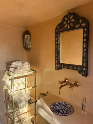 a bathroom with a sink and a mirror at RIAD VERT de Nina in Marrakech