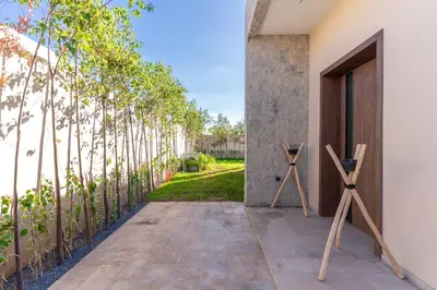 two wooden windmills on a patio with trees at Villa Wimiliim - Piscine et jardin Privée Sans vis-à-vis Wifi HD in Segraga