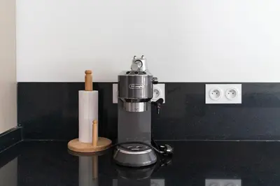 a coffee machine in a bathroom with a toilet at Villa Wimiliim - Piscine et jardin Privée Sans vis-à-vis Wifi HD in Segraga