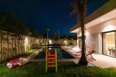 a swimming pool in the backyard of a house at night at Villa Wimiliim - Piscine et jardin Privée Sans vis-à-vis Wifi HD in Segraga