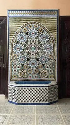 a large rug on a wall in a room at Villa with private pool in the center of marrakech in Marrakech