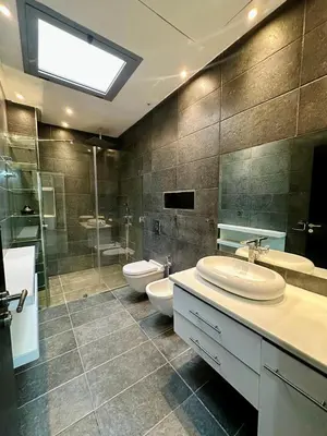 a bathroom with two toilets and two sinks and a shower at 5-star luxury villa with private pool in Marrakech