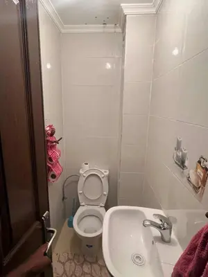 a small bathroom with a toilet and a sink at Chicafrik in Marrakech