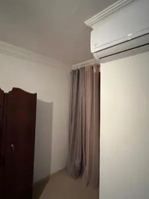 a room with a curtain and a window at Chicafrik in Marrakech