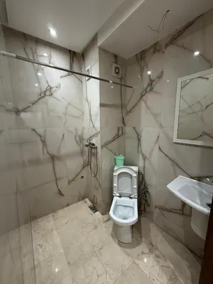 a bathroom with a toilet and a sink at Appartement a Marrakech centre in Marrakech