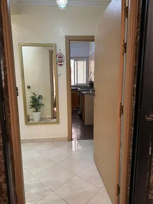 a hallway leading to a kitchen with a mirror at 2BR w Balcony in Gueliz 2 Bedroom Apartment with Balcony in Gueliz in Marrakech