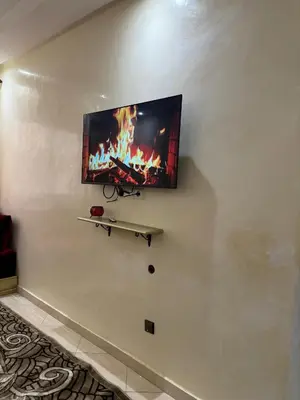 a flat screen tv hanging on a wall at 2BR w Balcony in Gueliz 2 Bedroom Apartment with Balcony in Gueliz in Marrakech
