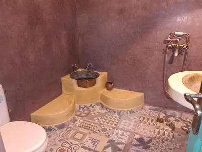 a bathroom with a sink and a toilet at Riad Yousra in Marrakech