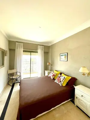 a bedroom with a large bed and a window at Rooftop Sun Pool Chic Apartment Perfect Stay in Marrakech