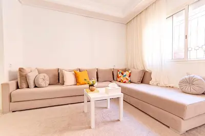 a living room with a couch and a table at NEW Cocon cosy au coeur de Marrakech in Marrakech