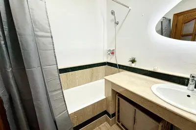 a bathroom with a sink and a shower at Menara Palms Marrakech in Marrakech