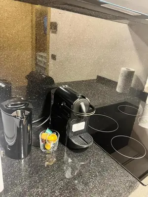 a black toaster sitting on a kitchen counter at Appartement cozy et central, Marrakech in Marrakech