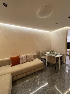 a living room with a couch and a table at Appartement cozy et central, Marrakech in Marrakech
