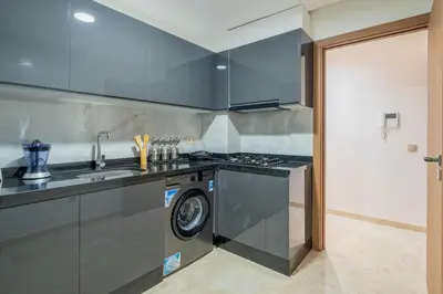 a kitchen with a washing machine and a sink at Rooftop piscine-new appartment - centre ville in Marrakech