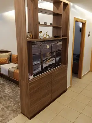 a room with a entertainment center in a living room at Loger marrakech in Marrakech