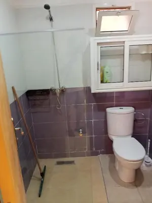 a bathroom with a toilet and a window at Loger marrakech in Marrakech