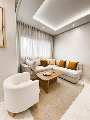 a living room with a couch and a table at Dream stay in Hivernage Pool-Balcony-Parking in Marrakech