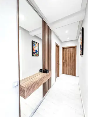 a hallway with a wooden bench in a house at Dream stay in Hivernage Pool-Balcony-Parking in Marrakech
