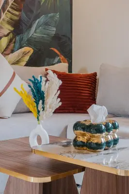 a coffee table with two plates on top of it at 2BR NEW Luxury apartment CityCenter in Marrakech