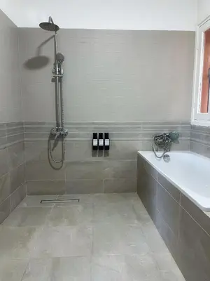 a bathroom with a shower and a bath tub at Villa Corail in Marrakech