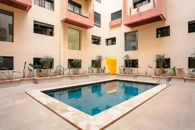 a swimming pool in the middle of a building at The Icon Boutique Hivernage in Marrakech