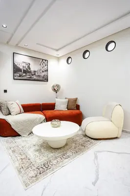 a living room with a couch and a table at The Icon Boutique Hivernage in Marrakech