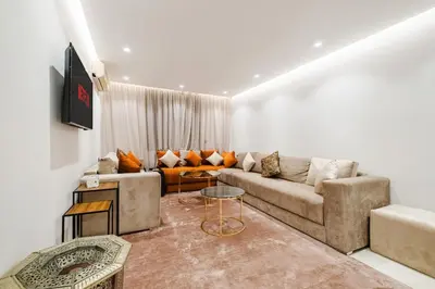 a living room with a couch and a table at NEW 2Br Family-Friendly, in the Heart of Marrakech in Marrakech