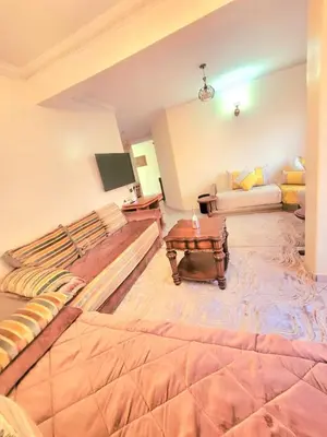 a large room with a bed and a couch at Gueliz - Authentic 3 Majorelle central Marrakech in Marrakech