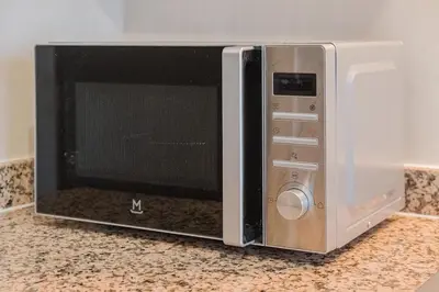 a microwave oven sitting on top of a counter at NEW 2Br Family-Friendly, in Center of Marrakech in Marrakech