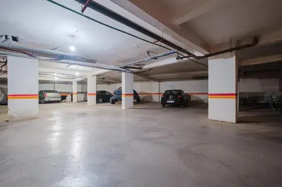an empty parking garage with cars parked in it at NEW 2Br Family-Friendly, in Center of Marrakech in Marrakech