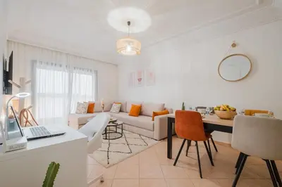 a living room with a couch and a table at NEW 2Br Family-Friendly, in Center of Marrakech in Marrakech