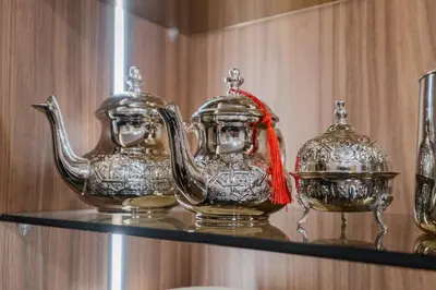 two silver teapots sitting on a shelf at NEW 1BR Apart Queensize AC 5 min to CityCenter in Marrakech