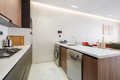a kitchen with a sink and a dishwasher at Modern Comfort in Heart of Marrakech in Marrakech