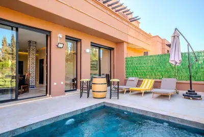 a house with a swimming pool and a patio at Villa Smahane - Comfort & Private Pool in Marrakech