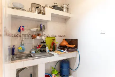 a kitchen with a sink and a counter top at Authentic Moroccan Stay Steps from Jemaa el-Fna in Marrakech