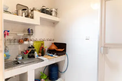a small kitchen with a counter and a sink at Authentic Moroccan Stay Steps from Jemaa el-Fna in Marrakech