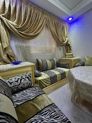a room with three beds and a window with curtains at Moroccan elegance Quiet & Comfort 5min airport in Marrakech