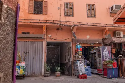 a building with a gate in front of a store at Apartment with panoramic views of Koutoubia in Marrakech