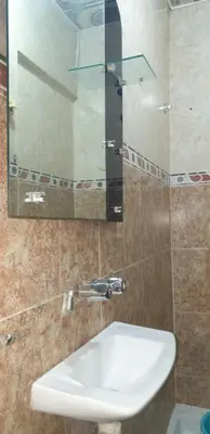 a bathroom with a sink and a mirror at Chez Omar in Marrakech