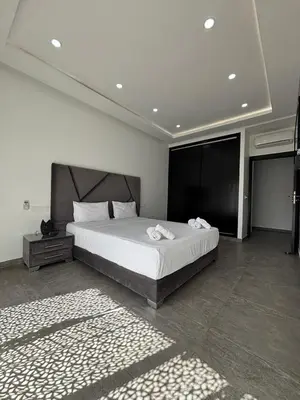 a bedroom with a large bed in a room at Magnifique villa spacieuse Route de l'ourika in El Rhechat