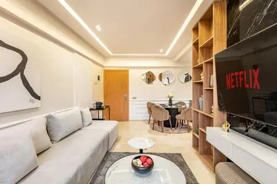 a living room with a couch and a table at Elegant 2BR Modern Prime District in Marrakech in Marrakech