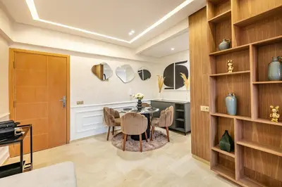 a dining room with a table and chairs at Elegant 2BR Modern Prime District in Marrakech in Marrakech