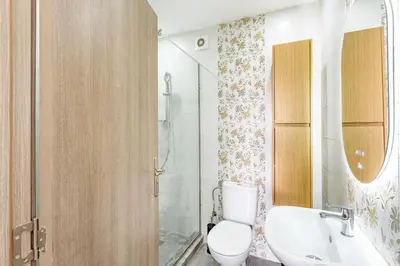 a bathroom with a toilet and a sink and a shower at Magnifique appartement 2 chambres route du barrage in Marrakech