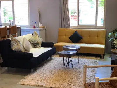 a living room with a couch and a table at Du coté de chez Ikram in Marrakech